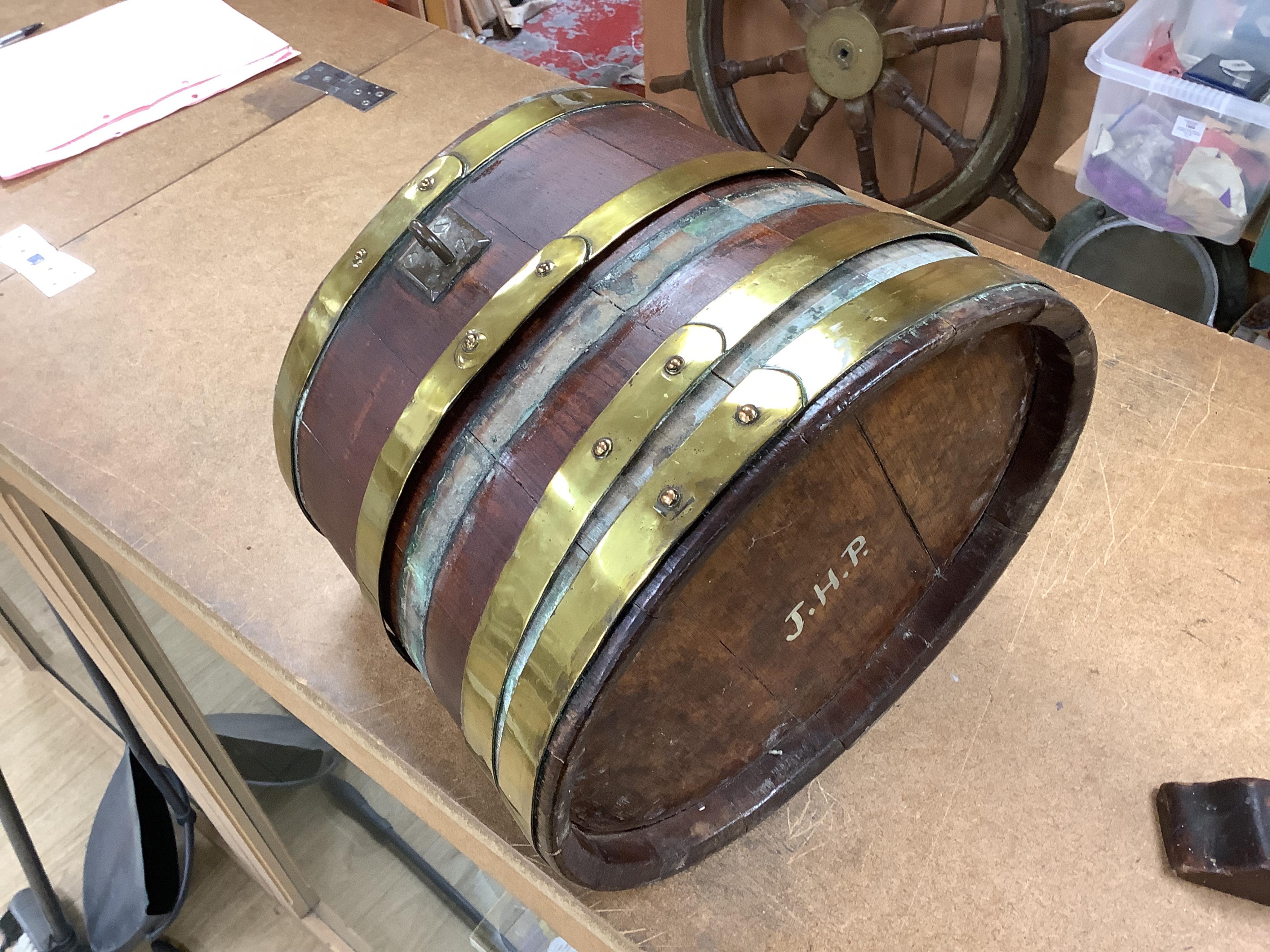 A 19th century teak and brass bound navy rum barrel on stand, 34cm high